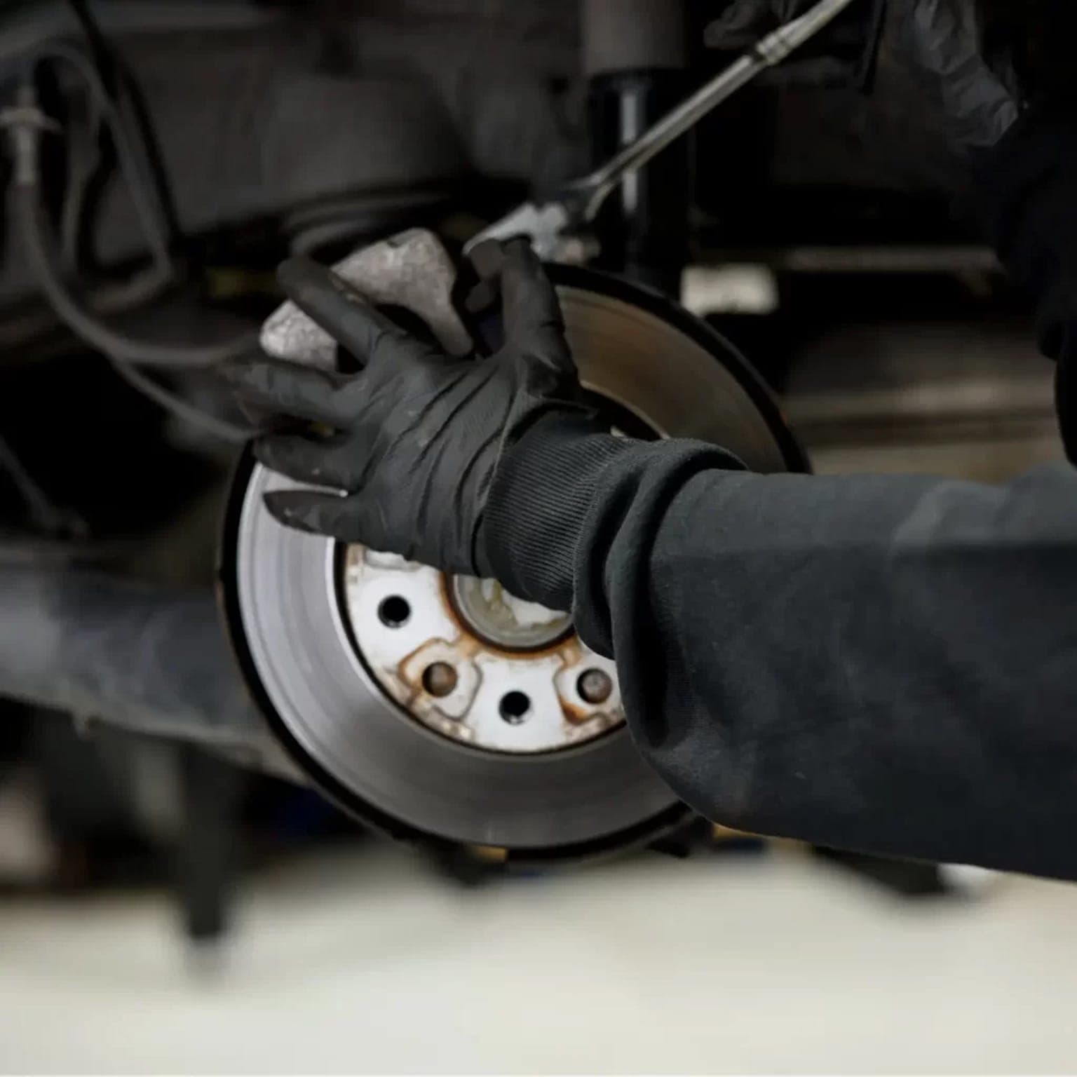 Leondis technician fitting brake components