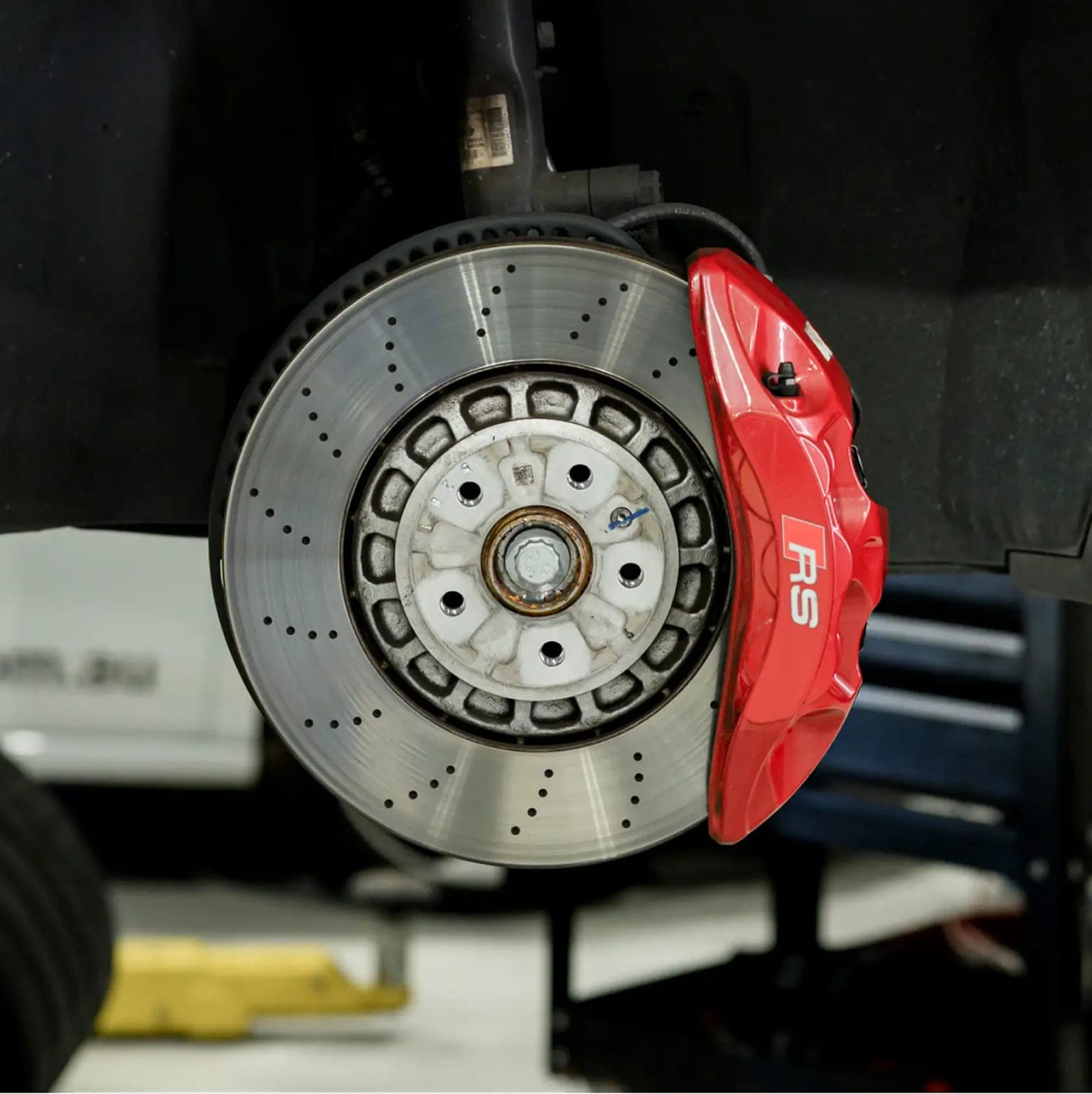 Brake disc and caliper inspection on a European car